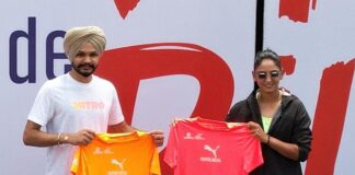 Delhi Half Marathon 2024 race day tees are introduced by Sarabjot Singh and Harmanpreet Kaur.