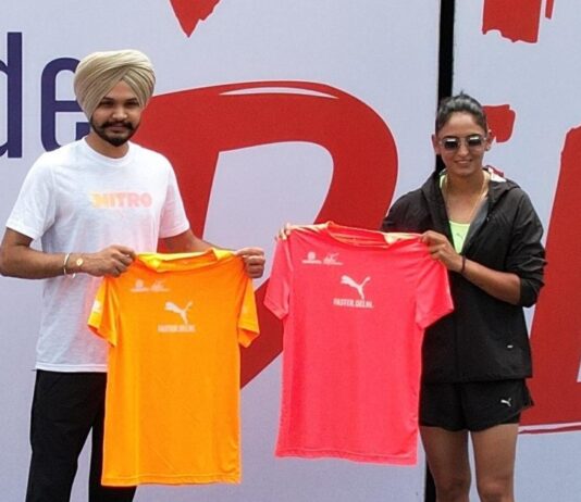 Delhi Half Marathon 2024 race day tees are introduced by Sarabjot Singh and Harmanpreet Kaur.